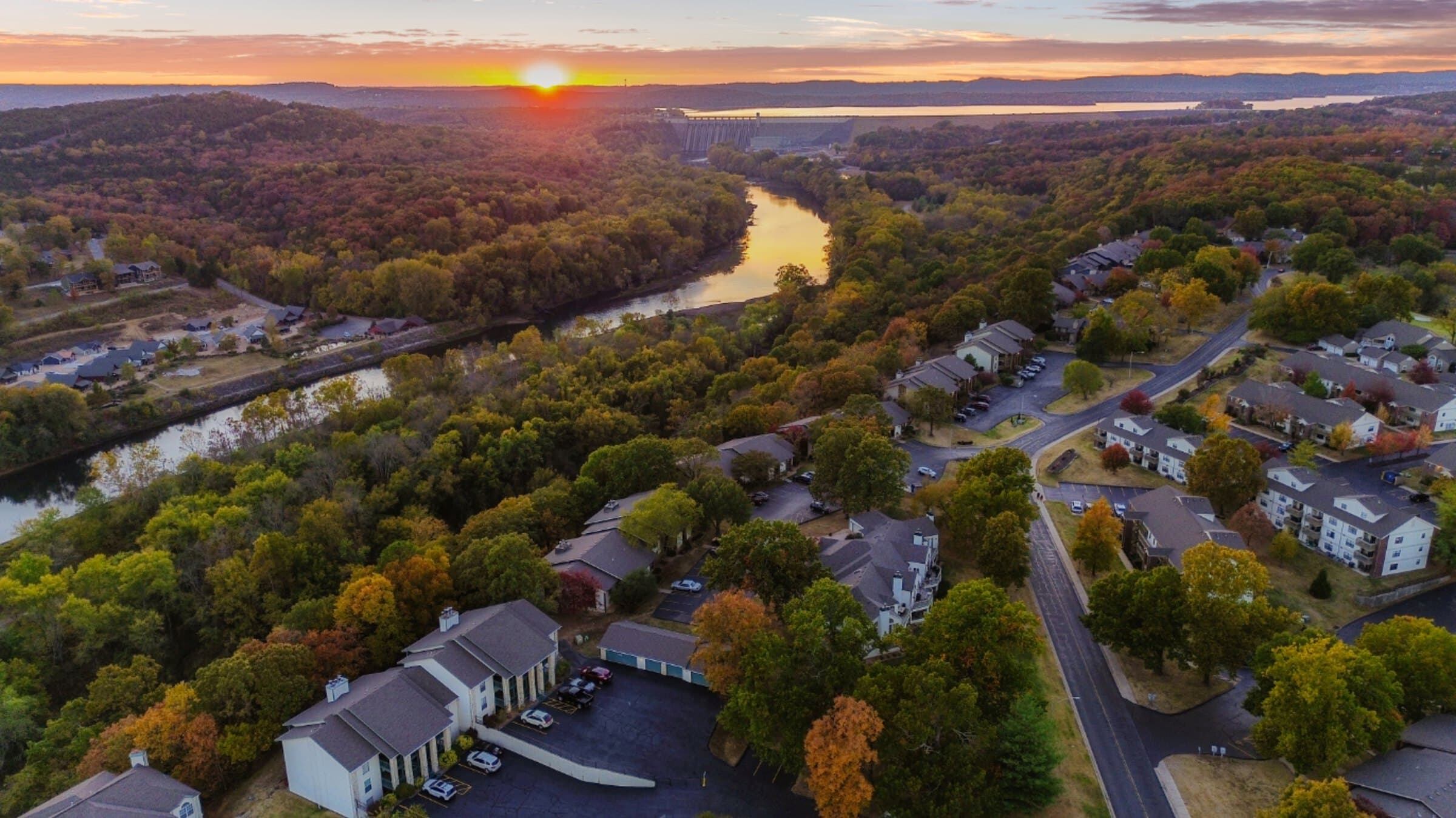 Aerial drone photo of a Table Rock Lake neighborhood near Branson at sunset