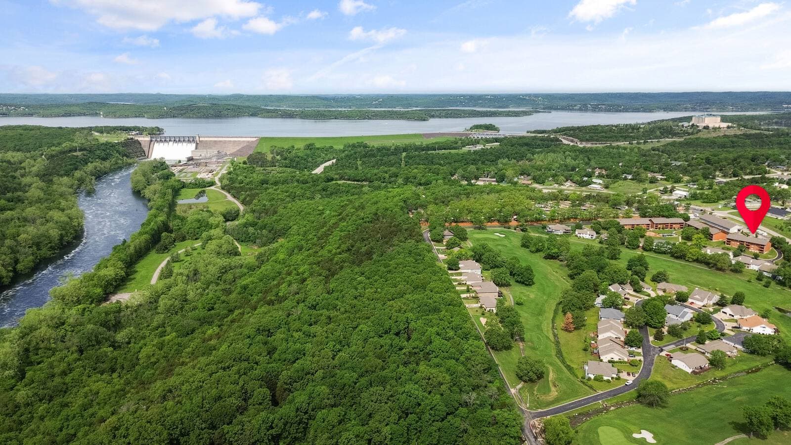 Aerial land photo with a property boundary marker overlay