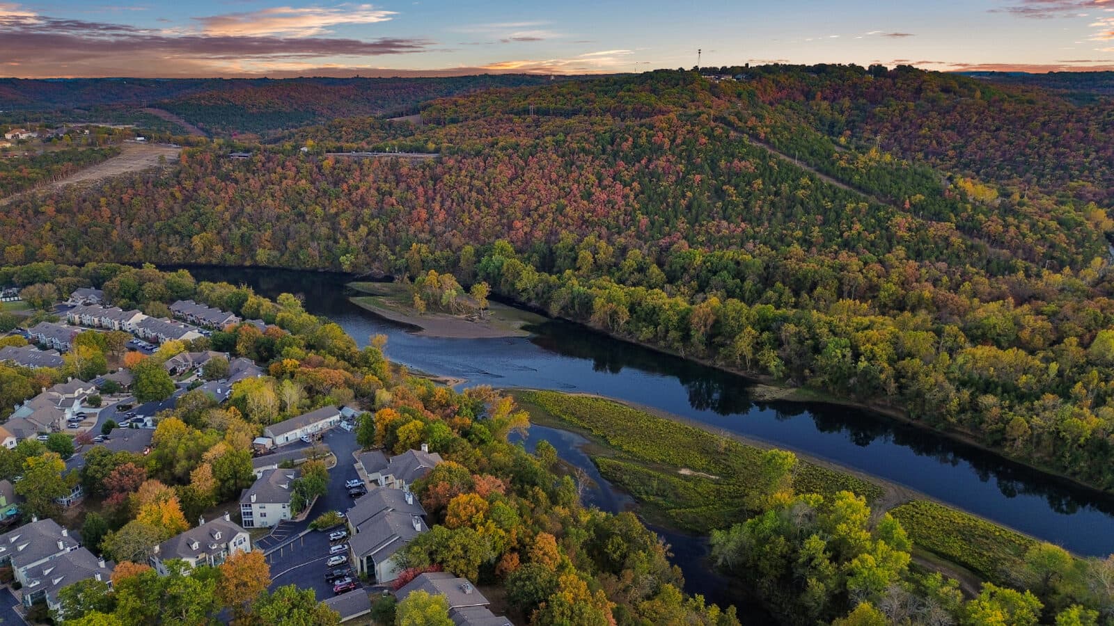 Autumn aerial over a winding river valley in the Ozarks