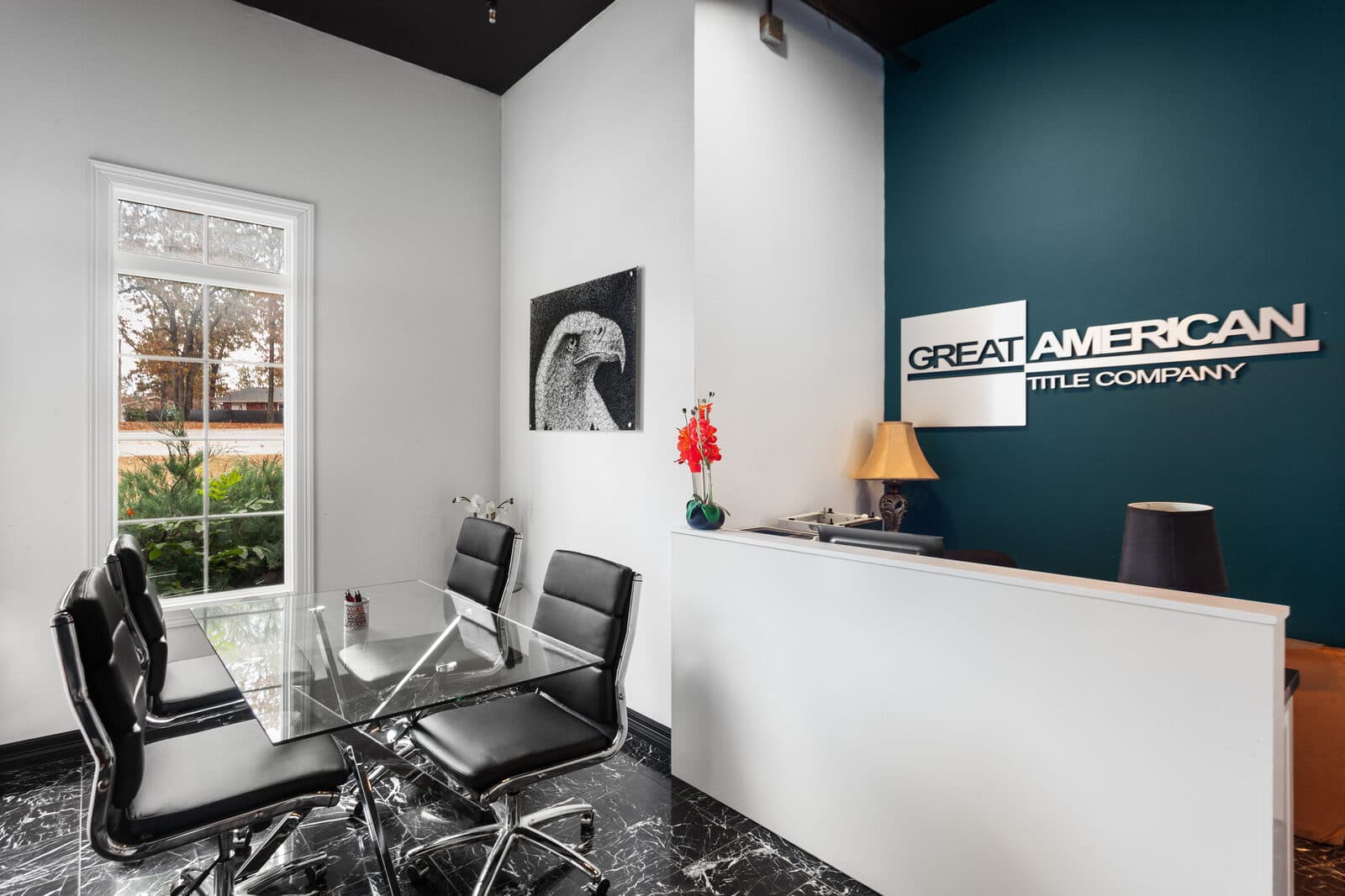 Office suite with workstations and a branded feature wall